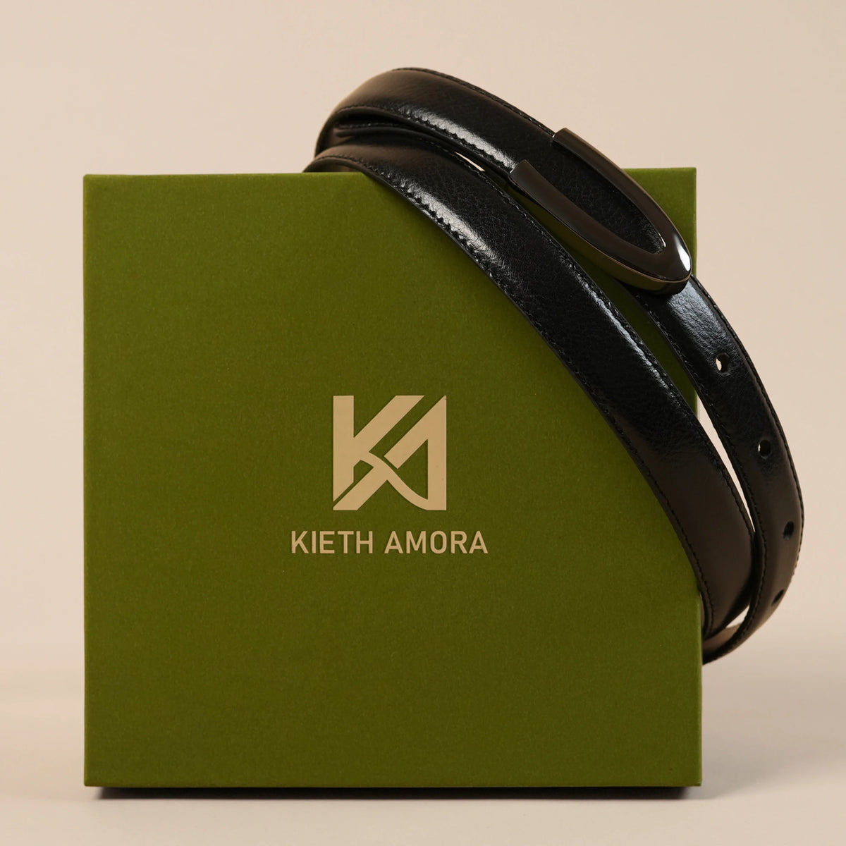 Darci black belt resting on the olive Kieth Amora gift box