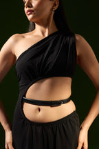 Woman in a black cut-out top and skirt wearing the Darci belt