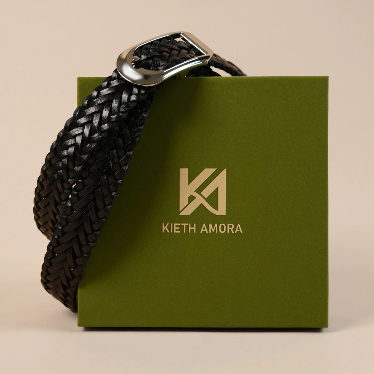 Rio black braided belt resting on the olive Kieth Amora gift box