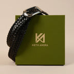 Rio black braided belt resting on the olive Kieth Amora gift box