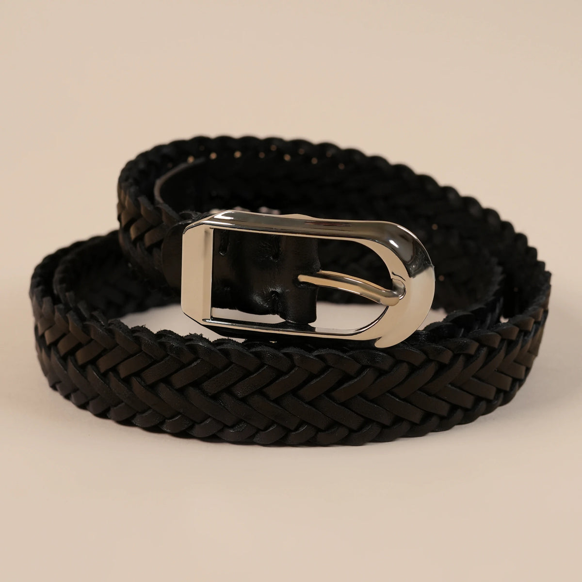 Close-up of the Rio belt's black braided weave and silver buckle
