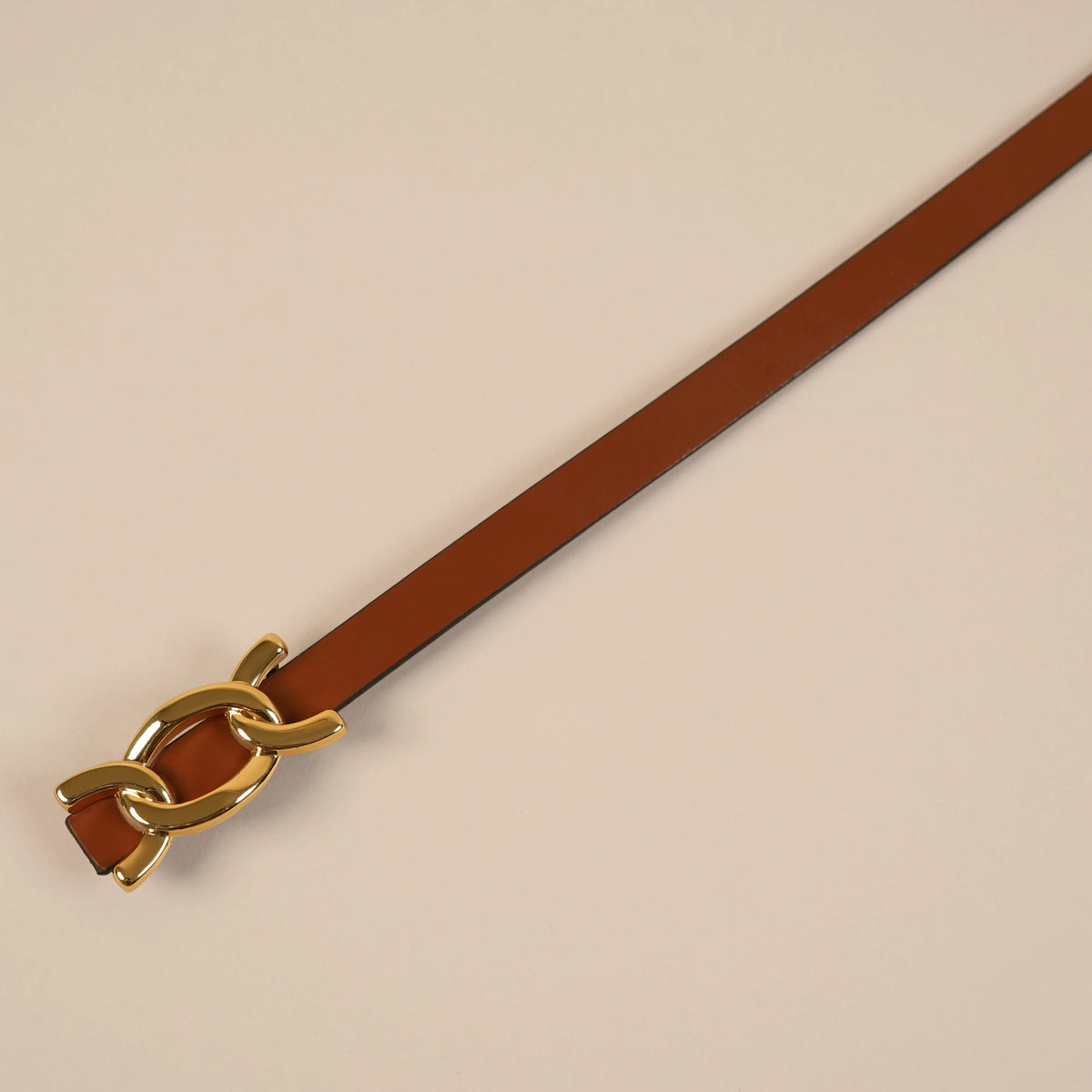 Scarlett brown belt tip and gold chain-link buckle