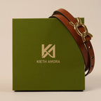 Scarlett brown belt resting on the olive Kieth Amora gift box