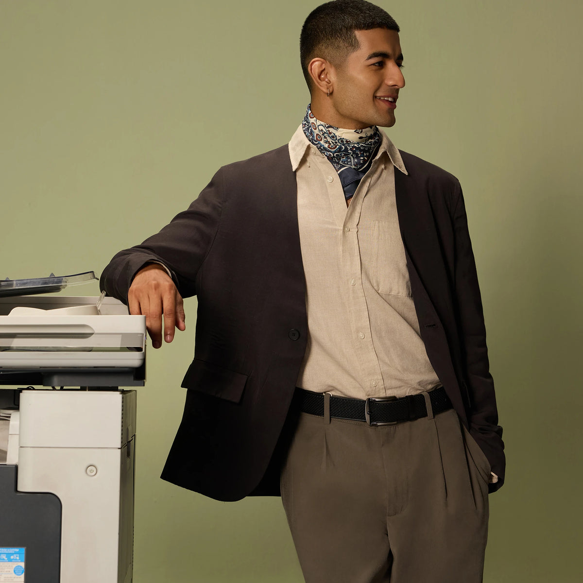 Man in a jacket and scarf wearing the Black Kyoto belt in an office