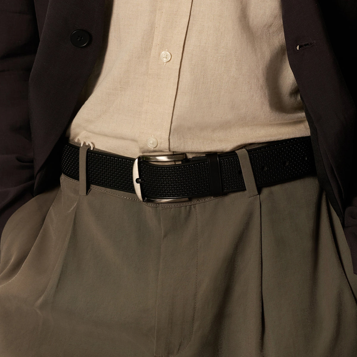 Black Kyoto belt worn with beige shirt, dark jacket and grey trousers