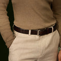 Brown Croco belt worn with a brown sweater and beige trousers