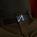 The OG Belt with KA monogram buckle worn with olive trousers