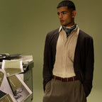 Man in a cream shirt, brown cardigan and bandana wearing the Savora reversible belt