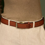 Tan Kyoto belt worn with a brown sweater and beige trousers